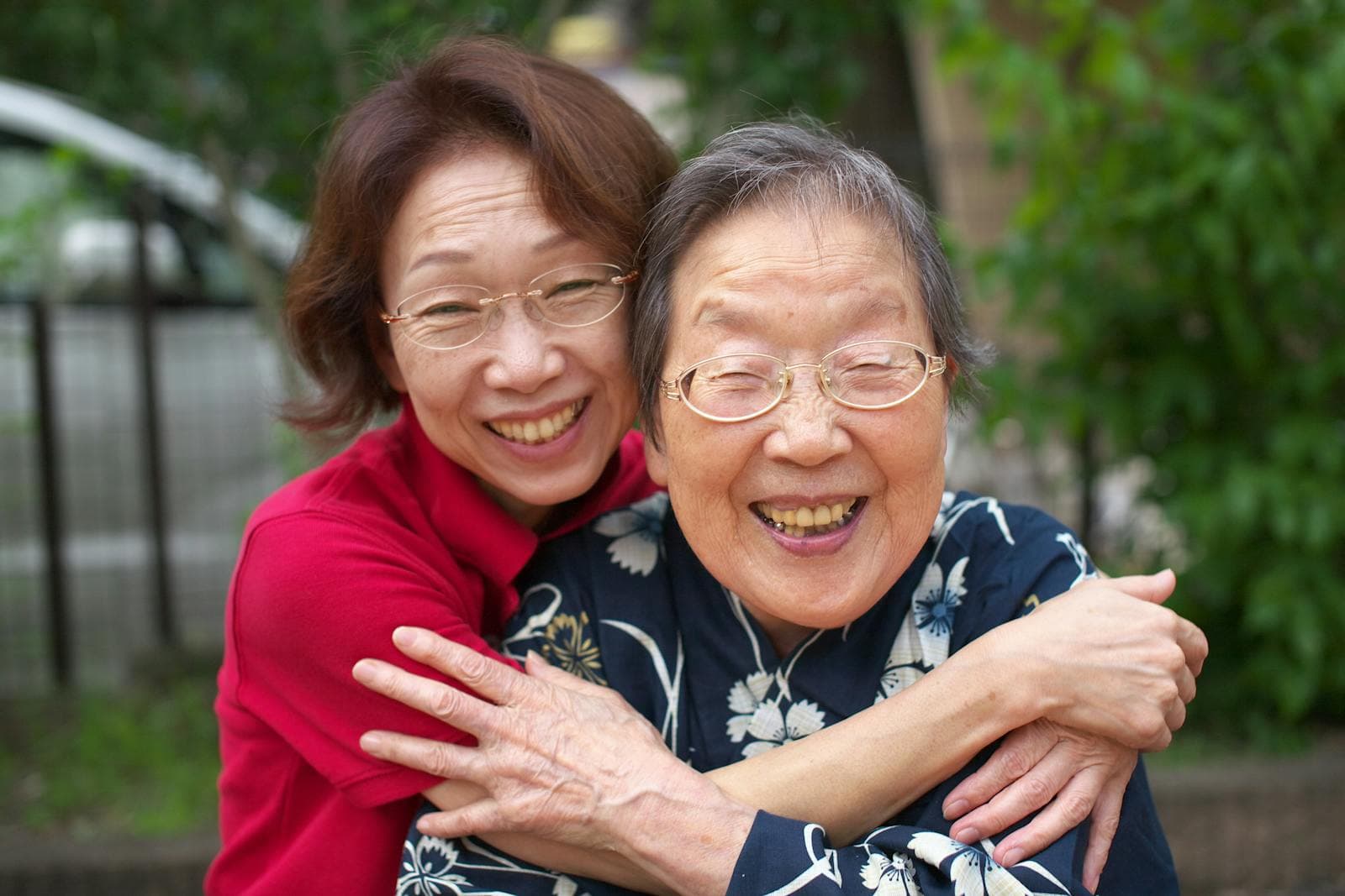 A caregiver sharing a warm moment with an elderly resident