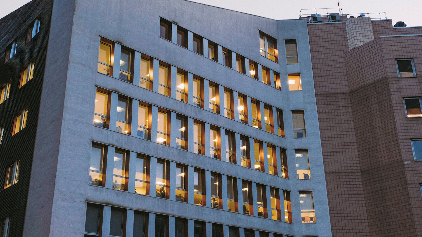 A modern medical building at dusk