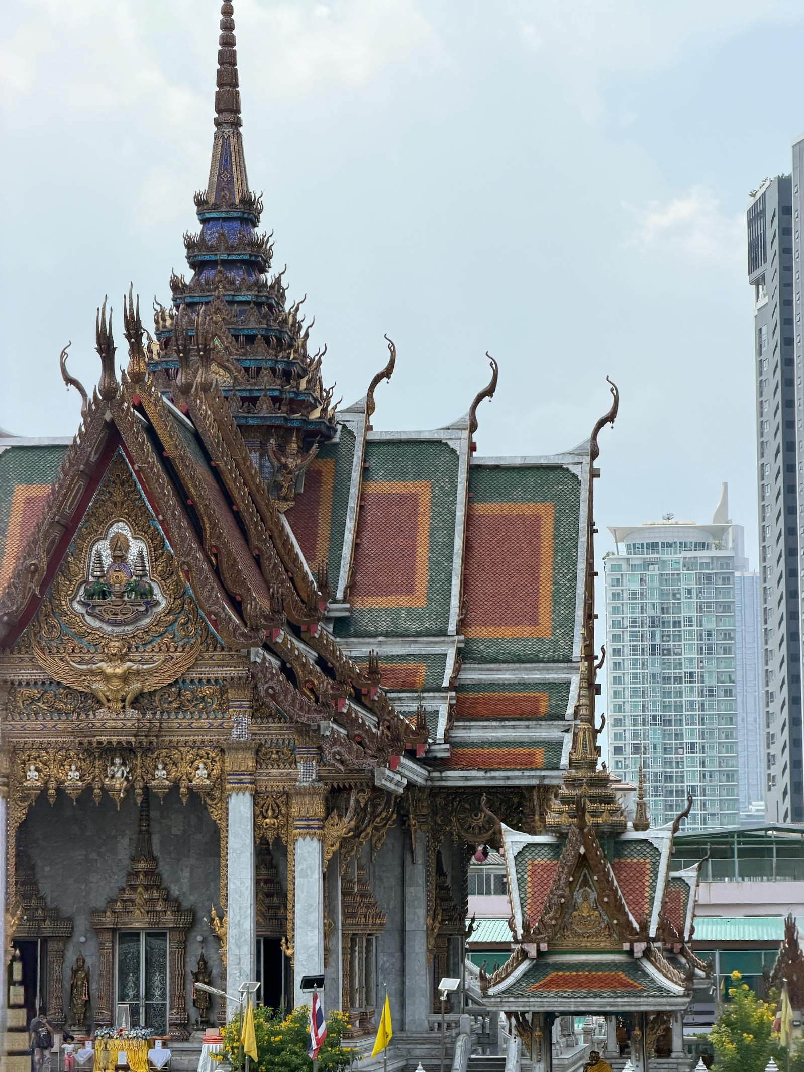 Bangkok temple framed by modern high-rises
