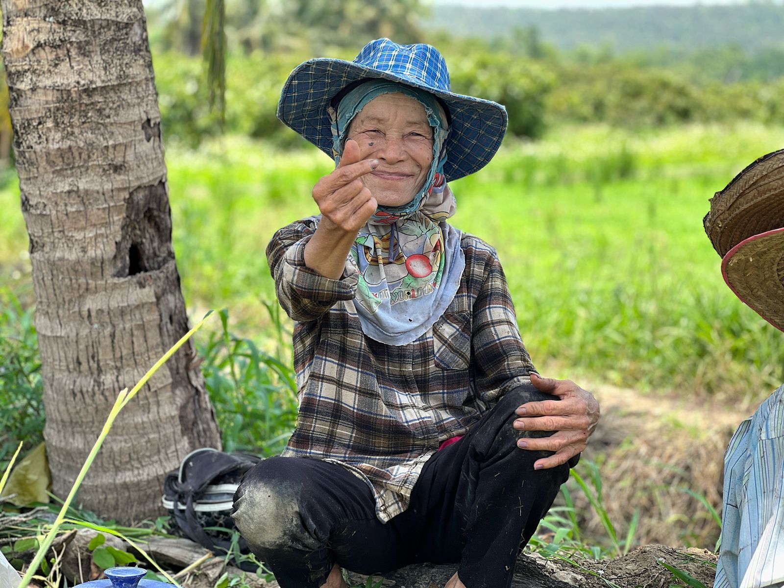 Smiling Thai senior outdoors